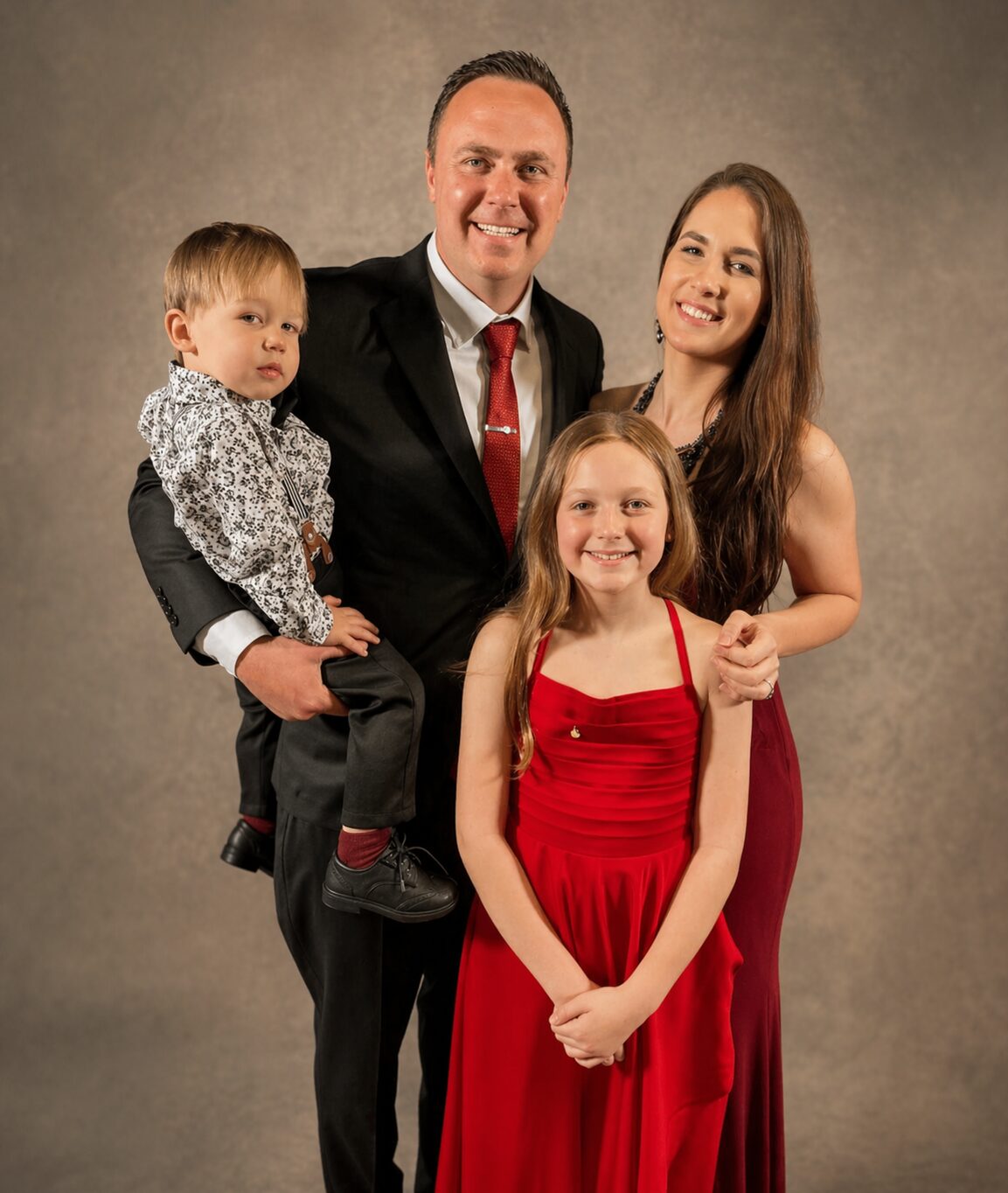 Jason Bergenske with his wife and two children